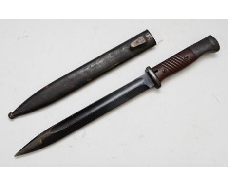 A WWII German K98 Mauser bayonet, 25cm blade stamped 44asw and 8502, the metal scabbard numbered 3705.This bladed product is 