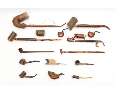 A collection of mid 20th century and later smoking pipes, to include a large meerschaum, briar wood pipes, an oriental carved