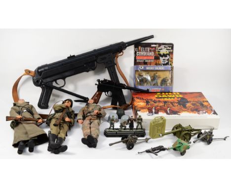 Three Action Man figures in full uniform, together with model diecast German soldiers, diecast model toy cannons, a plastic t