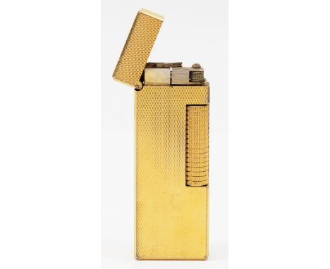 Alfred Dunhill; A Dunhill rollagas pocket cigarette lighter, gold plated with engine turned decoration.