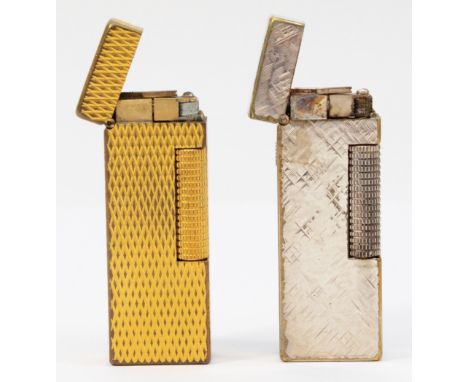 Alfred Dunhill; Two Dunhill rollagas pocket cigarette lighters, silver and gold plated examples. (2)