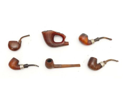 A collection of mid 20th century smoking pipes, comprising a snakeskin covered example, a large carved briar wood bowl, two K