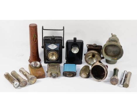 A collection of vintage lamps and torches including Smiths Wootton lantern, a Stewart R. Browne U.S bakelite miners safety to