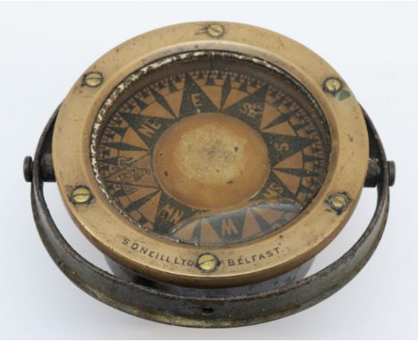 A brass ship's compass, stamped S. D. Neill Ltd, Belfast, 14cm diameter.