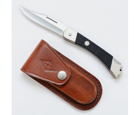 A Puma 270 stainless German flip knife, with leather case, 10cm.This bladed product is not for sale to people under the age o