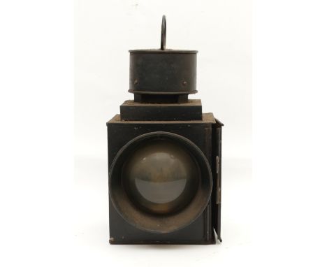 An unmarked railroad LMS style signal lamp with top carry handle and circular convex glass, complete with burner, H-31cm.