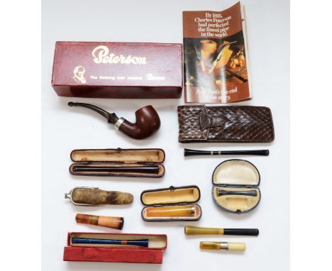 A collection of smoking related collectables, to include a boxed Peterson pipe, cased pipe stems and cased and loose cheroot 