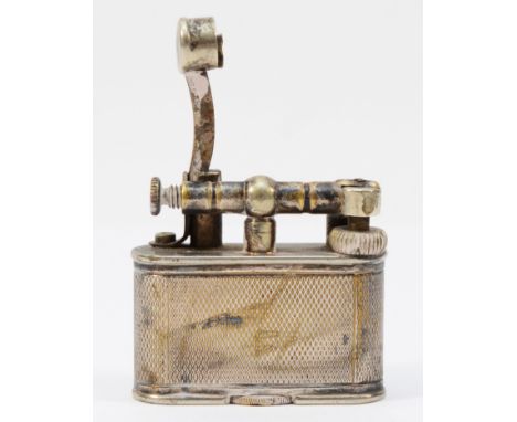 Alfred Dunhill; A 1930s ladies lift arm pocket cigarette lighter, silver plated with engine turned decoration, petrol filled,