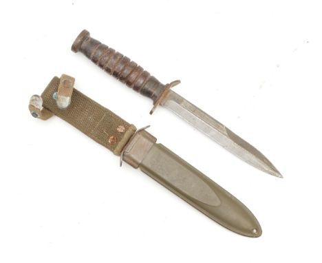 A WWII era US M3-Utica dagger, by B.M & Co and complete with the M8 scabbard, signed Eugene Levine 32116315 BR 65, 17cm blade