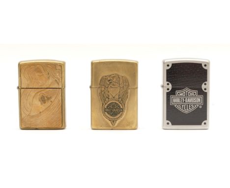 Three Zippo Harley Davidson lighters, two cased and one boxed. (3)
