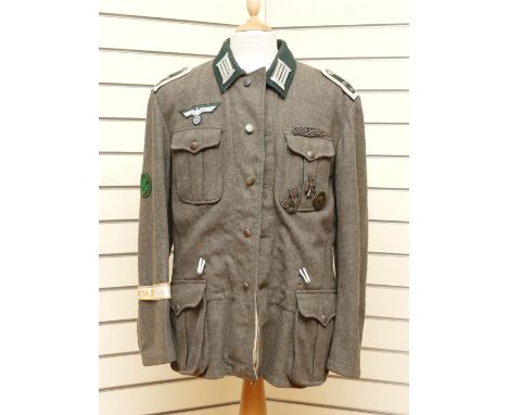 WWII German Third Reich M42 Army (Heer) Field Blouse, With various badges attached, to include the Close Combat Clasp which i