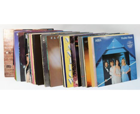 A collection of approximately 30 vinyl albums, primarily pop from the 70's and 80's, to include some artists such as: Barry M