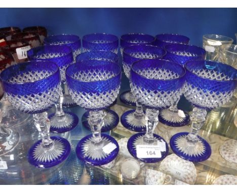 A COLLECTION OF TWELVE BLUE OVERLAID CUT-GLASS WINE GLASSES