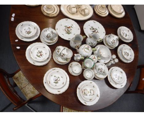 AN HUNGARIAN HEREND PORCELAIN PART TEA AND DINNER SERVICE, painted with bird, floral and insect decoration and a Herend urn-s