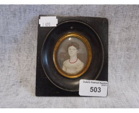 AN EARLY 19TH CENTURY MINIATURE PORTRAIT OF A YOUNG WOMAN 