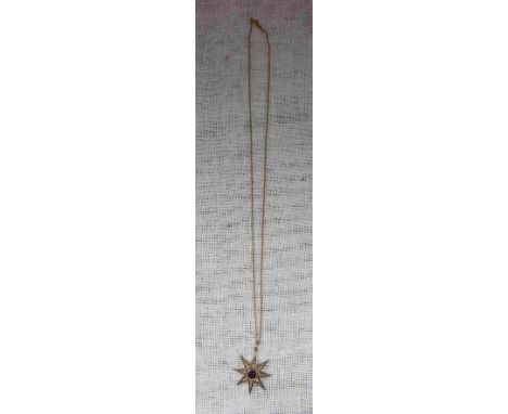 AN 'AMETHYST' AND SEED PEARL STAR-SHAPED PENDANT attached to a 15ct yellow gold fine link chain
