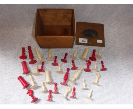 AN IVORY AND RED STAINED IVORY CHESS SET