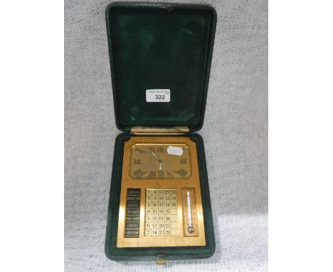 A TABLE CLOCK, calendar and thermometer in a fitted brass case with easel-back, in a fitted leatherette travelling case