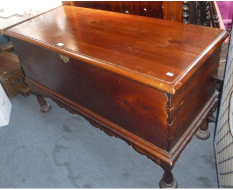 A LARGE CONTINENTAL STAINED PINE TRUNK ON LEGS, 29" high x 50" wide x 21" deep