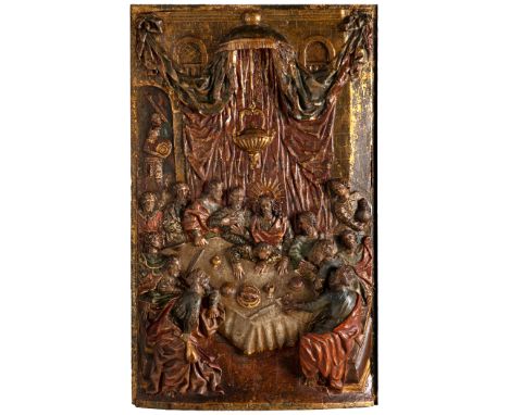 Tabernacle door from the early 17th century."The Last Supper".Relief in carved, gilded, stewed and polychrome wood.With its o