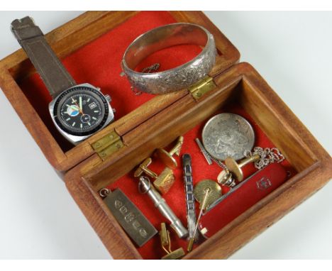 Wooden box containing a silver ingot ounce pendant, silver bangle, wristwatch etc