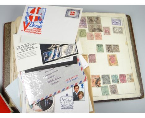 A stamp album & box containing a small parcel of first day covers etc