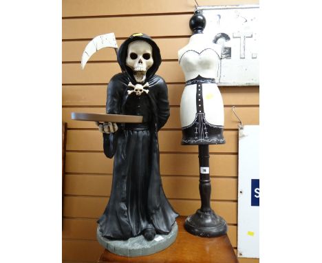 Small decorative mannequin together with a grim reaper figure