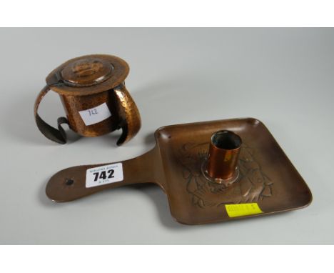 A Newlyn School copper chamber stick with a fish pattern together with a beaten copper Art Nouveau-style inkwell (being sold 