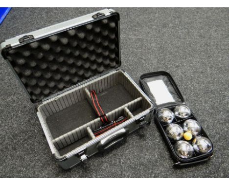 A metal camera carry case & boule set