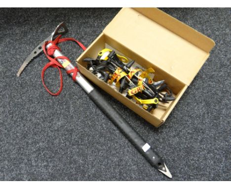 A pick axe & box of crampons 