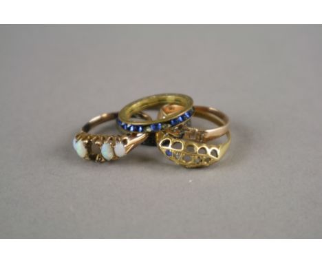 An 18ct gold sapphire and diamond ring (lacking two stones), together with an opal ring (lacking a stone) and a yellow metal 