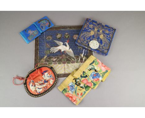 A collection of Chinese silkworks and other textiles, mainly 20th Century, including four reproduction rank badges, a purse w