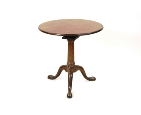 A George II mahogany tripod table the circular tilt top with bird cage action on a plain gun barrelled column and three down 