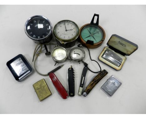 A group of collectables to include two automotive clocks, two volt meters, a prismatic compass, a set of precision weights, v