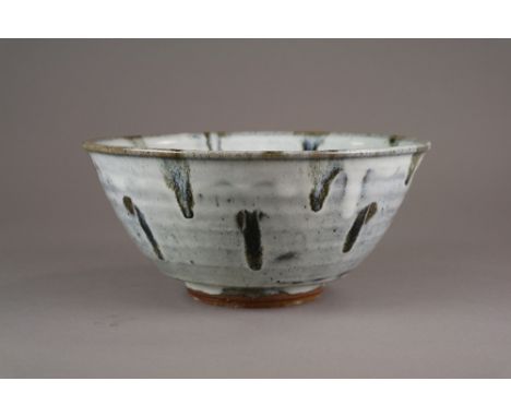 A Jim Malone stoneware bowl, of wide and gently ribbed funnel shape with inset foot ring, decorated with a nuka glaze suffuse