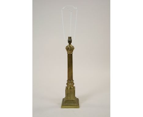 A gilt metal ionic column table lamp on stepped square plinth fitted for electricity, 49cm high excluding fittings