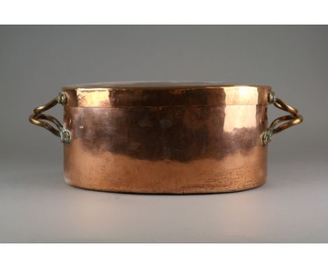 A copper two handled fish kettle and cover, 19th century, 40cm wide, a two handled copper jam pan, 41cm diameter, a handled c