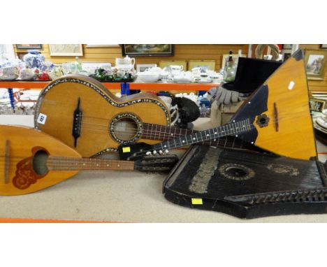 FOUR STRINGED INSTRUMENTS including classical guitar, mandolin, zither and balalaika (4)The label inside the guitar reads ‘re