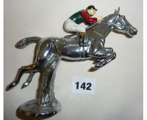 Vintage chrome car mascot in the form of a painted jockey on a jumping racehorse