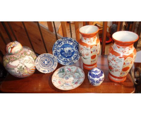 Shelf of Chinese porcelain vases, jars and plates, some A/F