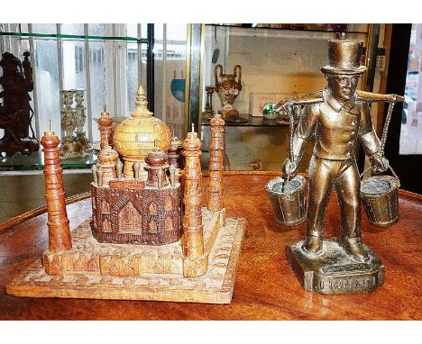 Metal Hummel figure and a carved wooden Taj Mahal