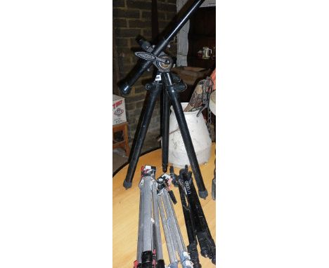 A Benbo camera tripod and three others