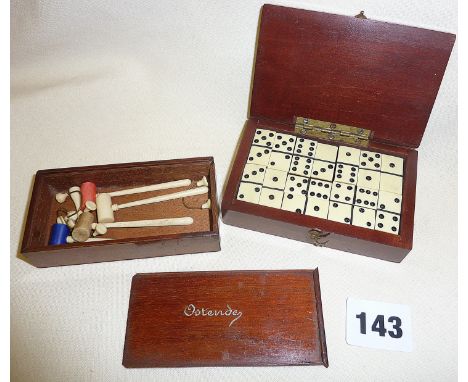 Antique miniature ivory table croquet set in mahogany box with sliding lid, and a set of miniature ivory and ebony dominoes i