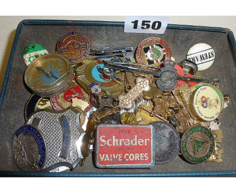 Vintage enamel and other badges in a Rowntree tin
