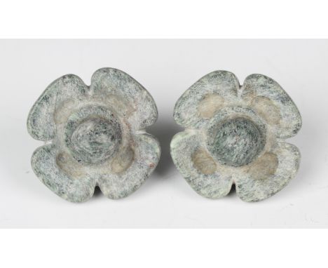 A pair of pre-Columbian Mayan style pale green hardstone waterlily ear spools, probably 250-550 AD, modelled with internal st