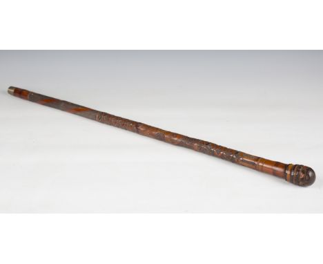 A late 19th century Japanese bamboo walking cane, carved in overall relief with birds and foliage, length 90cm.Buyer’s Premiu