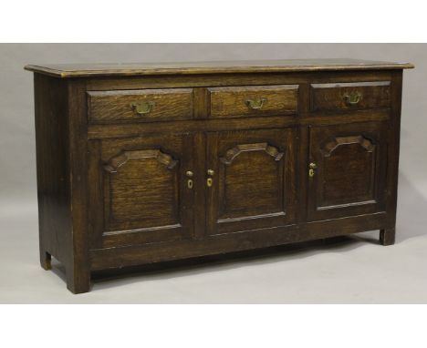 A late 20th century oak sideboard, fitted with two drawers above three cupboard doors, height 86cm, width 167cm, depth 49cm.B