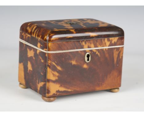 An early Victorian tortoiseshell tea caddy, the hinged lid revealing two lidded compartments, width 13cm, together with a tor