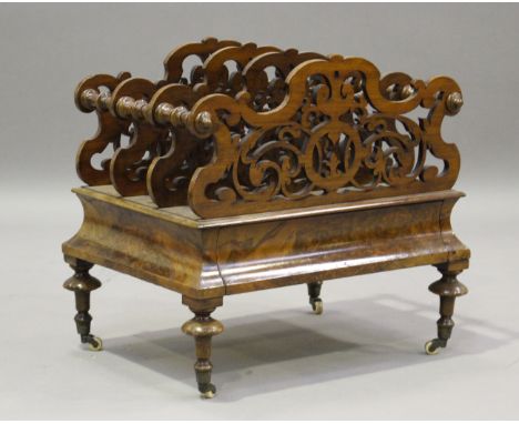 A mid-Victorian burr walnut Canterbury, the pierced fretwork divisions above a drawer, on turned legs and castors, height 49c