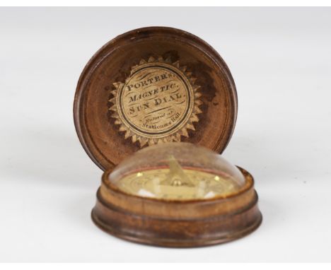 A 19th century treen cased pocket sundial, the lid interior bearing paper label, detailed 'Porters Magnetic Sun Dial entered 